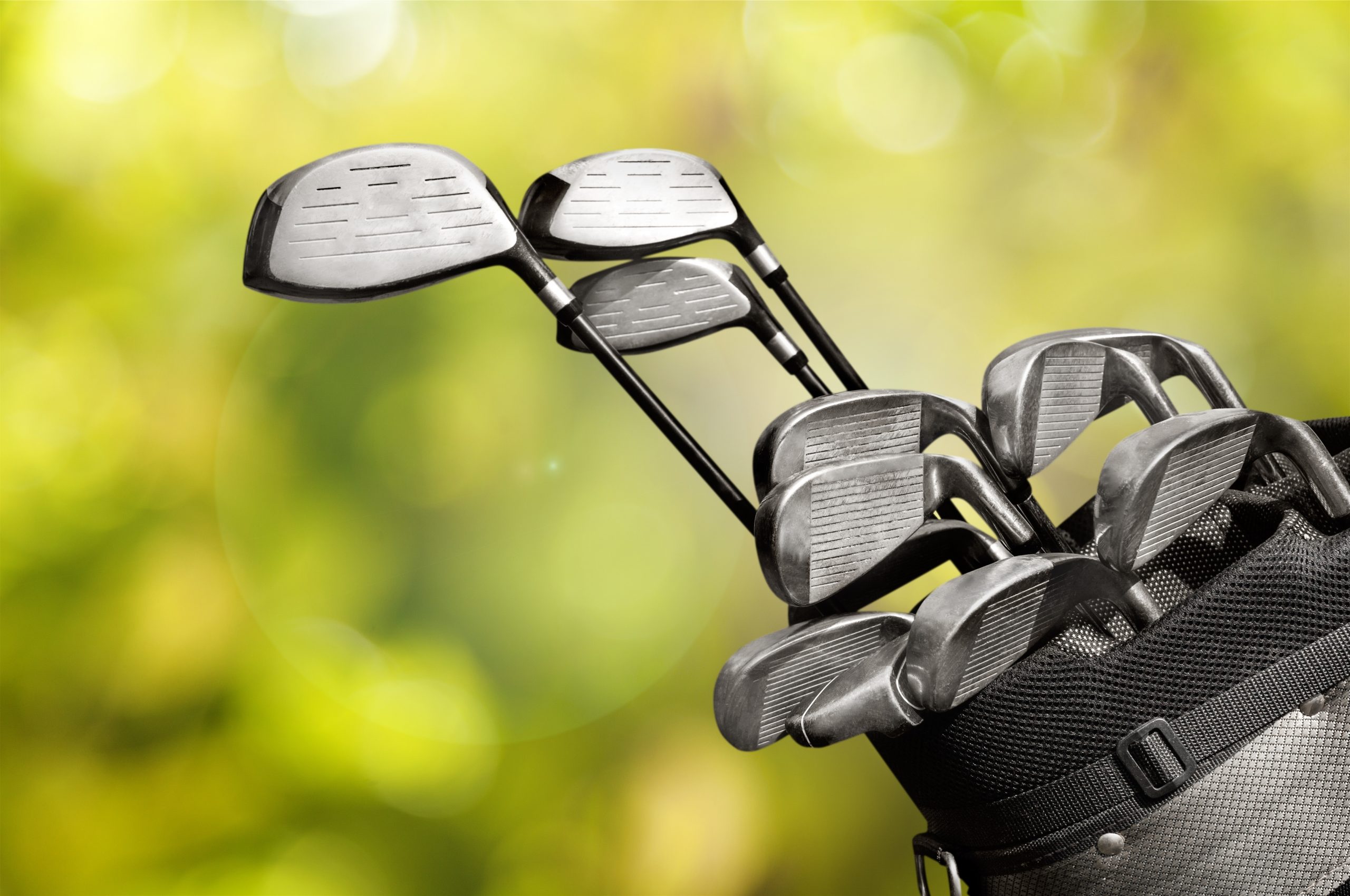 Different golf clubs on background. The Links at Brunello